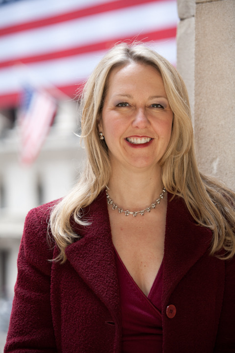 Kim Ann Curtin in front of the New York Stock Exchange